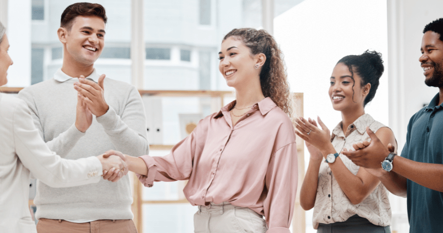 woman viewing hr compliance checklist with team in background