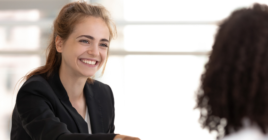woman viewing hr compliance checklist with team in background