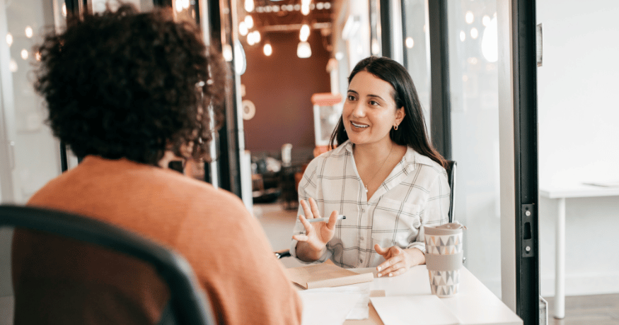 hr_admin_services_0019_Layer 3 woman viewing hr compliance checklist with team in background