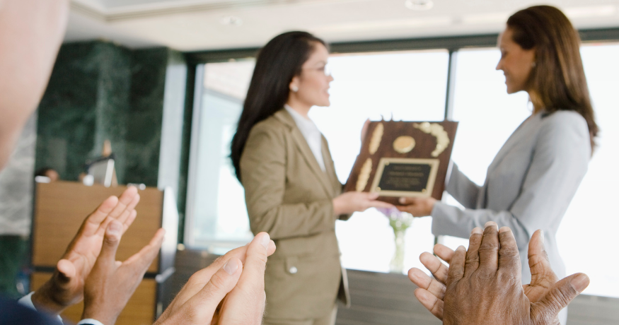 woman viewing hr compliance checklist with team in background