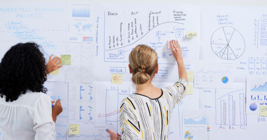 woman viewing hr compliance checklist with team in background