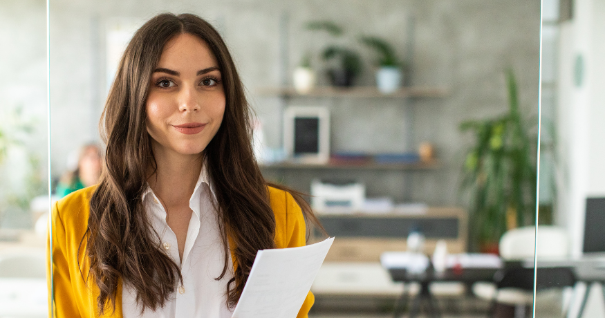 woman viewing hr compliance checklist with team in background