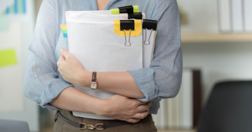 woman viewing hr compliance checklist with team in background