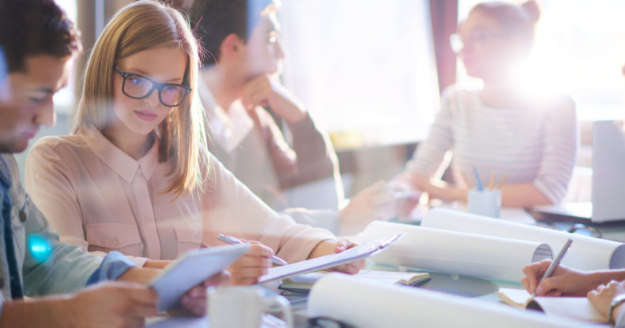 woman viewing hr compliance checklist with team in background