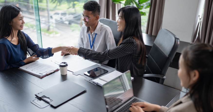 hr_admin_services_0019_Layer 3 woman viewing hr compliance checklist with team in background
