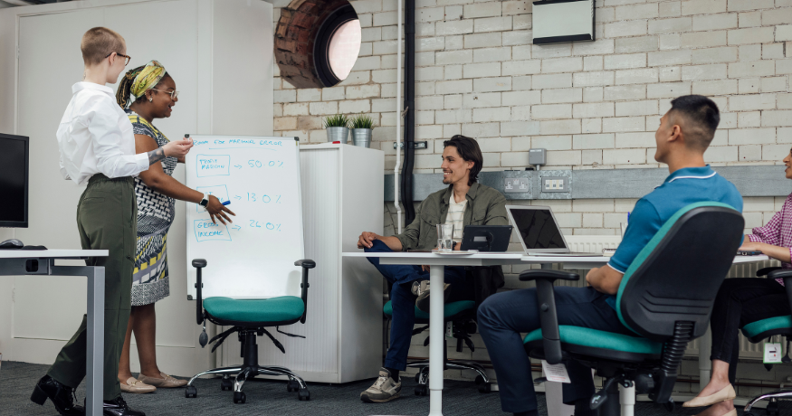 woman viewing hr compliance checklist with team in background