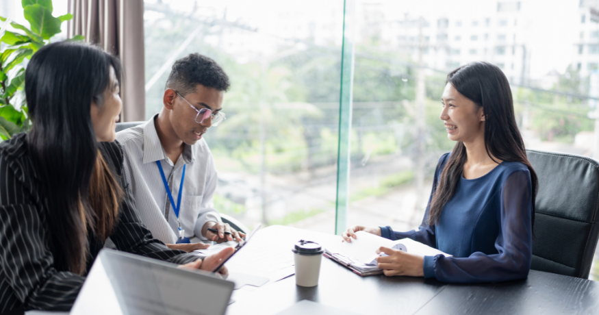 hr_admin_services_0019_Layer 3 woman viewing hr compliance checklist with team in background