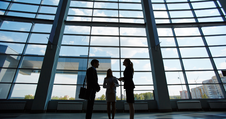 hr_admin_services_0019_Layer 3 woman viewing hr compliance checklist with team in background