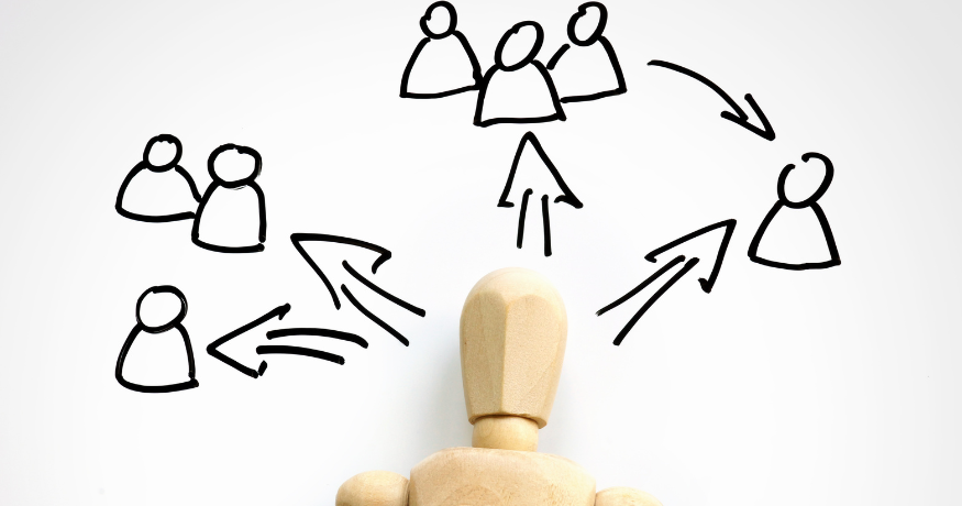 woman viewing hr compliance checklist with team in background