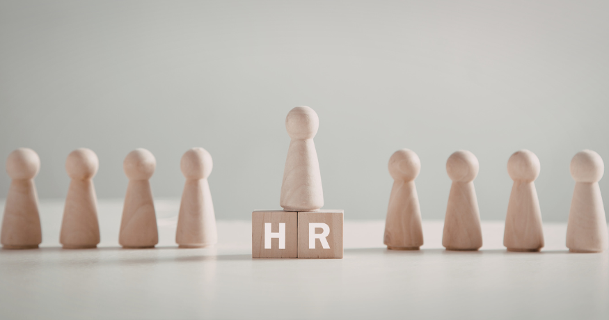 hr_admin_services_0019_Layer 3 woman viewing hr compliance checklist with team in background