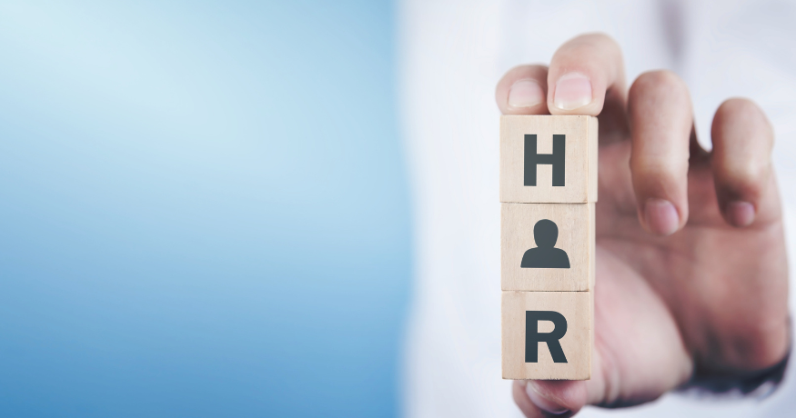 hr_admin_services_0019_Layer 3 woman viewing hr compliance checklist with team in background