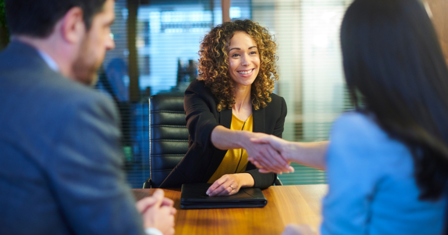 hr_admin_services_0019_Layer 3 woman viewing hr compliance checklist with team in background