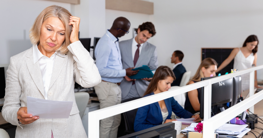 hr_admin_services_0019_Layer 3 woman viewing hr compliance checklist with team in background