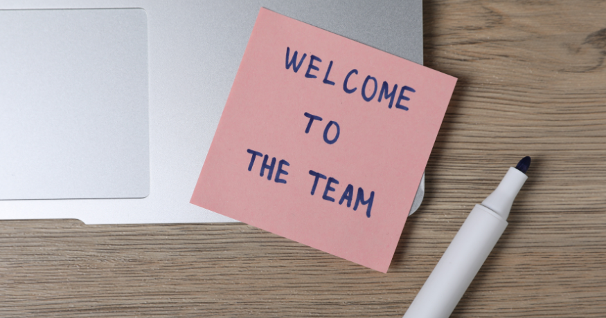 hr_admin_services_0019_Layer 3 woman viewing hr compliance checklist with team in background