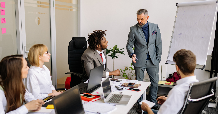 hr_admin_services_0019_Layer 3 woman viewing hr compliance checklist with team in background