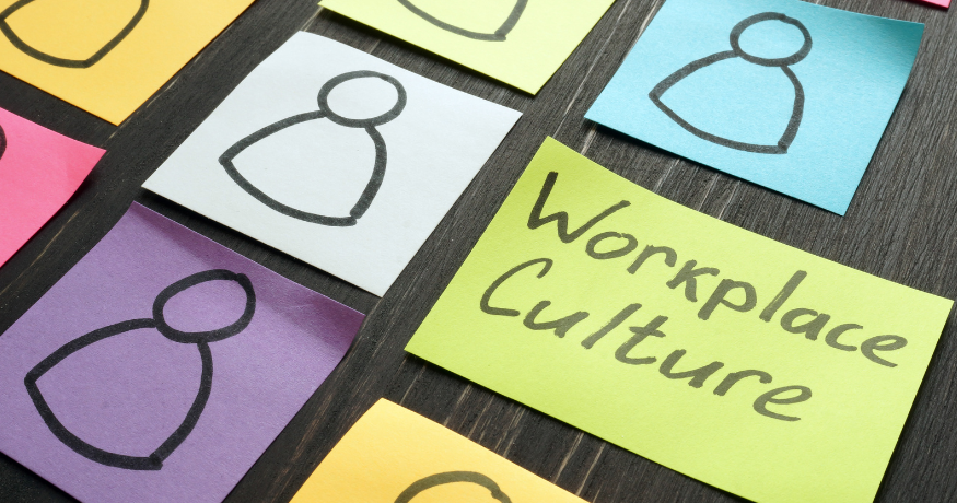 hr_admin_services_0019_Layer 3 woman viewing hr compliance checklist with team in background