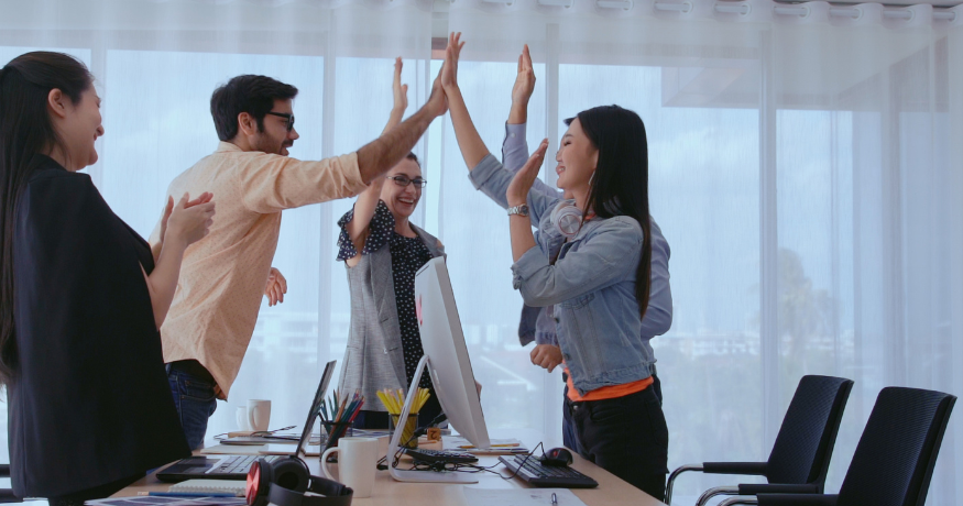 hr_admin_services_0019_Layer 3 woman viewing hr compliance checklist with team in background