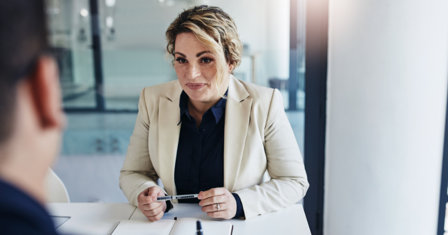 hr_admin_services_0019_Layer 3 woman viewing hr compliance checklist with team in background