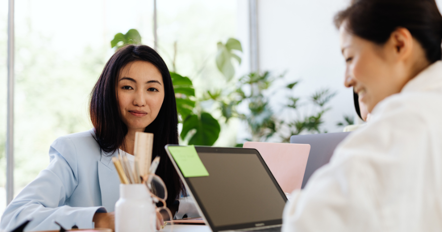 hr_admin_services_0019_Layer 3 woman viewing hr compliance checklist with team in background