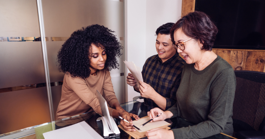 hr_admin_services_0019_Layer 3 woman viewing hr compliance checklist with team in background