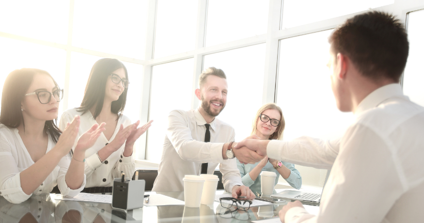 hr_admin_services_0019_Layer 3 woman viewing hr compliance checklist with team in background