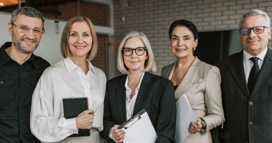 hr_admin_services_0019_Layer 3 woman viewing hr compliance checklist with team in background