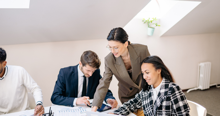 hr_admin_services_0019_Layer 3 woman viewing hr compliance checklist with team in background