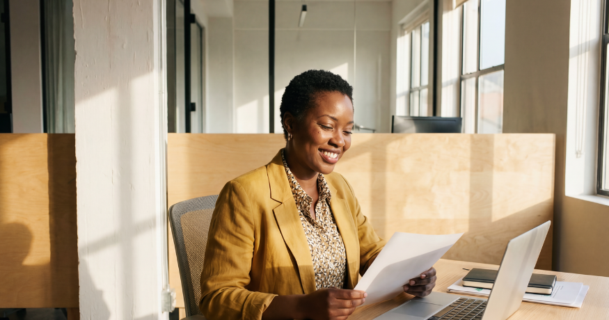 hr_admin_services_0019_Layer 3 woman viewing hr compliance checklist with team in background
