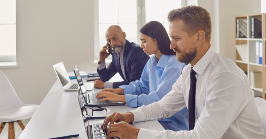 hr_admin_services_0019_Layer 3 woman viewing hr compliance checklist with team in background