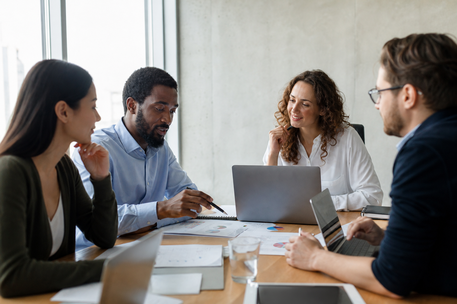 hr_admin_services_0019_Layer 3 woman viewing hr compliance checklist with team in background